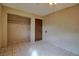Clean bedroom with tiled flooring, ceiling fan, closet and neutral walls at 1413 Culley St, Las Vegas, NV 89110