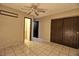 Neutral bedroom with a ceiling fan, and a closet with sliding doors at 1413 Culley St, Las Vegas, NV 89110