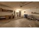 Spacious garage with shelving, water heater, chairs and storage at 1413 Culley St, Las Vegas, NV 89110