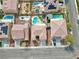 Overhead shot of homes with pools and solar panels, reflecting modern living and sustainability in a residential area at 1609 Danielle Rebecca Ave, North Las Vegas, NV 89086