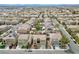 Expansive aerial view of a neighborhood with houses, showcasing community layout and residential architecture at 1609 Danielle Rebecca Ave, North Las Vegas, NV 89086
