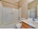 Bright bathroom featuring a tub and shower combination with vanity and toilet at 1609 Danielle Rebecca Ave, North Las Vegas, NV 89086