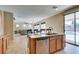 Open kitchen features stainless steel appliances, granite countertops, and seamless access to living area at 1609 Danielle Rebecca Ave, North Las Vegas, NV 89086