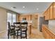 Bright kitchen features a breakfast bar, stainless steel appliances, and lots of storage space at 1609 Danielle Rebecca Ave, North Las Vegas, NV 89086