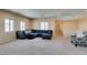 Large bonus room features carpeting, recessed lighting, comfortable seating, and multiple windows at 1609 Danielle Rebecca Ave, North Las Vegas, NV 89086