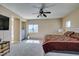Spacious main bedroom with ceiling fan, carpet, and lots of natural light at 1609 Danielle Rebecca Ave, North Las Vegas, NV 89086