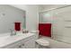 Bathroom featuring a sliding glass door, red towel, and white vanity at 1924 S 6Th St, Las Vegas, NV 89104