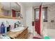 This bathroom has single sink, a granite countertop, decorative mirror and shower/tub combination at 1924 S 6Th St, Las Vegas, NV 89104