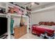 Bedroom with built-in shelving, closet and red bedding at 1924 S 6Th St, Las Vegas, NV 89104
