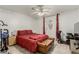 Cozy bedroom with ceiling fan, ensuite door, and tiled floor at 1924 S 6Th St, Las Vegas, NV 89104