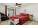 Bedroom featuring sliding glass door, tiled floors and white bench at 1924 S 6Th St, Las Vegas, NV 89104