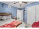 Comfortable bedroom with blue walls, featuring a cozy bed and ample closet space at 1924 S 6Th St, Las Vegas, NV 89104