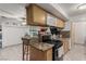 Eat-in kitchen featuring wooden cabinets, granite countertops, tile flooring, and recessed lighting at 1924 S 6Th St, Las Vegas, NV 89104