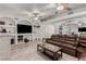 Bright living room with a large leather couch, tile floors, and recessed shelving at 1924 S 6Th St, Las Vegas, NV 89104