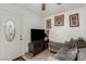 Comfortable living room with a large TV and a decorative front door at 1924 S 6Th St, Las Vegas, NV 89104