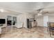 Basement living room area with tile flooring, kitchenette, and sliding door to outside at 1924 S 6Th St, Las Vegas, NV 89104