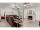Comfortable living room featuring a fireplace, brown leather sofas, and access to the backyard at 1924 S 6Th St, Las Vegas, NV 89104
