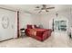 Bright main bedroom featuring tile floors, a ceiling fan, closet, and sliding glass doors to the patio at 1924 S 6Th St, Las Vegas, NV 89104