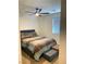 Bedroom featuring neutral walls, a ceiling fan, and a comfortable bed with stylish bedding at 1926 Neoga St, Las Vegas, NV 89115