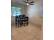 Cozy dining area with tile flooring and a ceiling fan at 1926 Neoga St, Las Vegas, NV 89115