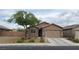 Charming single-story home with a two-car garage and desert landscaping at 1926 Neoga St, Las Vegas, NV 89115
