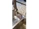 Stainless steel Kraus kitchen sink with running water and granite countertops at 1926 Neoga St, Las Vegas, NV 89115