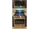 Stainless steel LG gas range oven appliance with overhead microwave, ideal for cooking enthusiasts at 1926 Neoga St, Las Vegas, NV 89115
