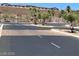 Gated community entrance featuring lush landscaping and a secure entry point at 2175 Limestone Cove Ct, Laughlin, NV 89029