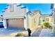 Charming single-story home featuring desert landscaping, a two-car garage, and a tile roof at 2175 Limestone Cove Ct, Laughlin, NV 89029