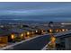 Night view of a residential neighborhood with city lights in the distance, showcasing a peaceful community at 2175 Limestone Cove Ct, Laughlin, NV 89029