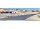 A street view showcasing the neighborhood and surrounding houses at 2175 Limestone Cove Ct, Laughlin, NV 89029
