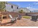 Backyard patio with chairs and string lights at 2572 Favorable Pointe Ct, Henderson, NV 89052