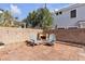 Backyard patio with chairs and string lights at 2572 Favorable Pointe Ct, Henderson, NV 89052