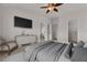 Staged bedroom with TV, dresser and ceiling fan at 2572 Favorable Pointe Ct, Henderson, NV 89052