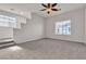 An empty bedroom features carpet, a ceiling fan, and bright windows at 2572 Favorable Pointe Ct, Henderson, NV 89052