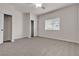 Bright bedroom featuring a large window, ceiling fan, and lots of closet space at 2572 Favorable Pointe Ct, Henderson, NV 89052