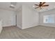 Large, carpeted bonus room with ceiling fan and an abundance of natural light at 2572 Favorable Pointe Ct, Henderson, NV 89052
