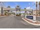 Elegant community entrance featuring a decorative archway and landscaping, showcasing a welcoming atmosphere at 2572 Favorable Pointe Ct, Henderson, NV 89052