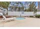 Relaxing community hot tub area with lounge chair, perfect for unwinding and enjoying the outdoors at 2572 Favorable Pointe Ct, Henderson, NV 89052