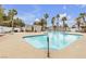 Inviting community pool with a pool house and lounge chairs, offering a great space for relaxation and recreation at 2572 Favorable Pointe Ct, Henderson, NV 89052