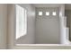 Bright hallway features a window with blinds and a view of the staircase at 2572 Favorable Pointe Ct, Henderson, NV 89052
