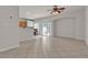 Bright living room with tile floors, breakfast bar, and sliding glass doors to outdoor space at 2572 Favorable Pointe Ct, Henderson, NV 89052