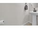 Pedestal sink powder room with gray towel at 2572 Favorable Pointe Ct, Henderson, NV 89052