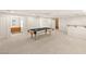 Spacious finished basement featuring a billiard table, carpet floors, and a wet bar for entertaining guests at 2694 Caumsett Ct, Las Vegas, NV 89117