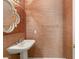 Powder room featuring textured walls, pedestal sink, and modern fixtures at 2694 Caumsett Ct, Las Vegas, NV 89117