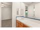Bathroom featuring a vanity with a sink, a toilet, a glass shower, and a large mirror at 2694 Caumsett Ct, Las Vegas, NV 89117