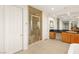Bathroom with glass shower, tile floor, and wood cabinets at 2694 Caumsett Ct, Las Vegas, NV 89117