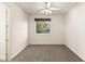 Empty bedroom showcasing neutral-colored walls, carpet, and a window that provides natural light at 2694 Caumsett Ct, Las Vegas, NV 89117