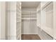 Walk-in closet features custom white shelving and clothing racks at 2694 Caumsett Ct, Las Vegas, NV 89117