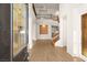 Grand foyer with a soaring staircase, gleaming hardwood floors, and abundant natural light at 2694 Caumsett Ct, Las Vegas, NV 89117